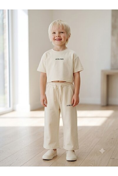 Motebarn Wear طقم كريمي مكون من قطعتين للفتيات - تي شيرت قصير أساسي مطبوع وبن...