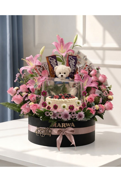 TagerElSaadah Luxury gift box containing cake, flowers, chocolates, and a ted...