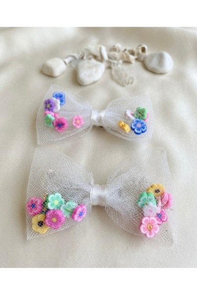 the Littles Kids 2 Pieces of Ribbon Clips with Pompoms, Pearls, and Flowers
