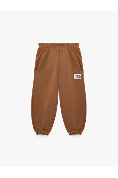 Koton Pocket Detailed Three-Thread Raster Label Printed Jogger Sweatpants wit...