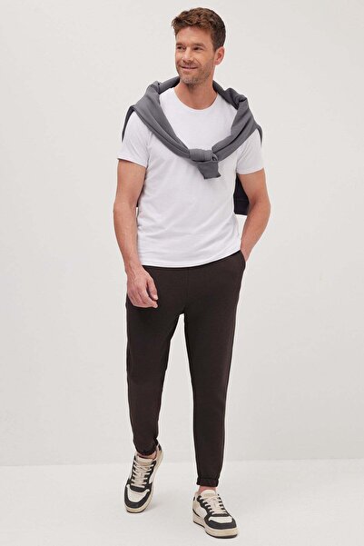 Tudors Unisex relaxed fit fleece-lined sweatpants with 3 pockets and elastica...