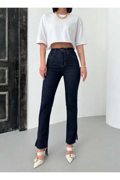 LACARINO Denim pants with cut-outs and tassel details