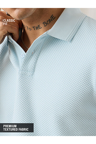 The Souled Store By Styli قميص بولو رجالي كلاسيكي من القطن بنسيج محبب بلون أز...