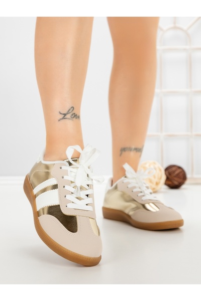 Anderina Women's golden sports shoes made of ecological Leather Arivela