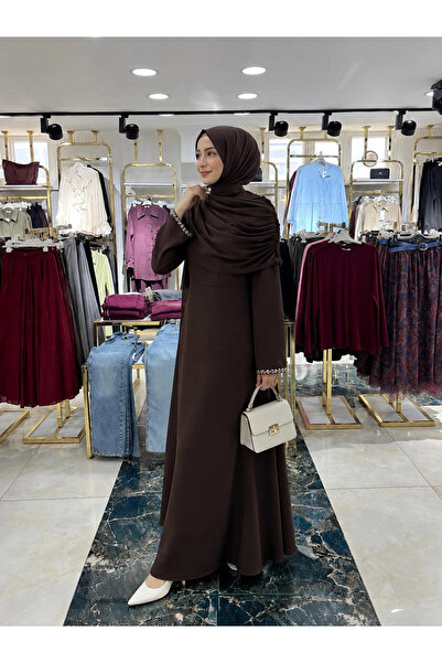 Butik Kahverengi Double Kumaş Pelerinli Kolları Taş Detaylı Abiye Modelimiz