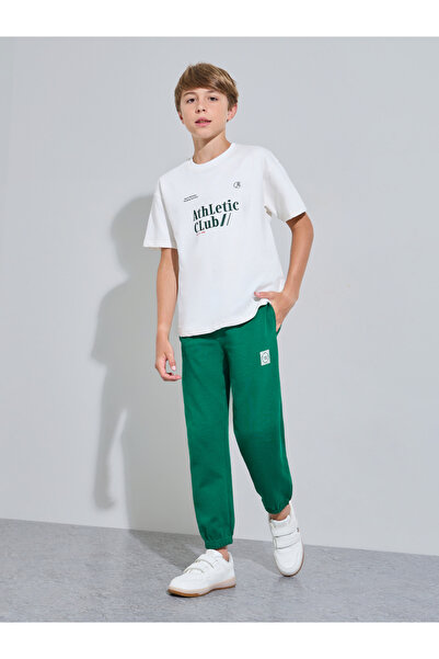 Styli Teen Boys Off White Graphic Print T-Shirt and Green Joggers Set