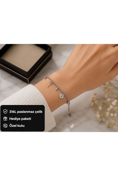 HER ŞEY NOTA www.herseynota.com Steel Women's Bracelet with Key and Lock Deta...