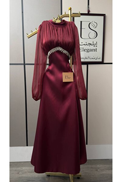 ELEGANTKSA فستان سهرة راقٍ بلون العنابي الفاخر، بتصميم أنثوي يجمع بين النعومة...
