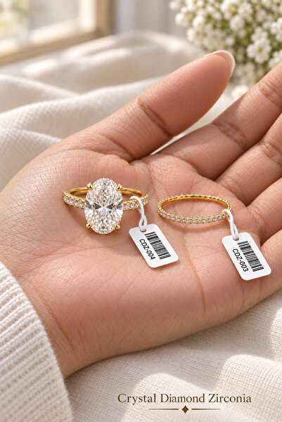 Crystal Diamond Zirconia Işıklı kutuda 6 karat oval kesim tektaş ve 0.25 kara...