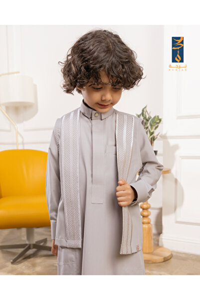 burjah Sadi for the Authenticity Thobe Is Warm Gray Myal for Beige.