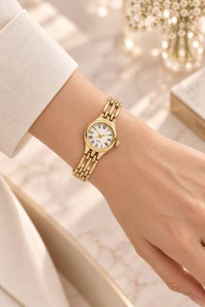 GANYMET Women's Wristwatch Gold Color Fine Steel Band White Dial Roman Numera...
