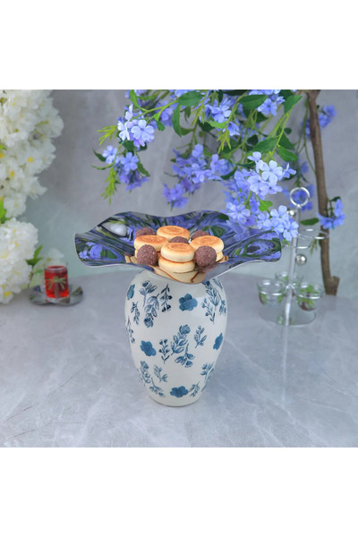 Al Hadaya Mall Stainless steel serving dish with a modern and distinctive cer...