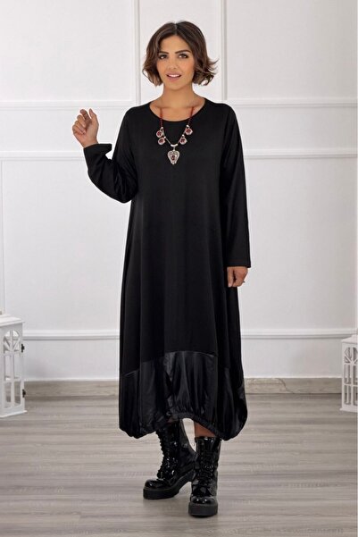 Nevin Kaya Moda فستان أسود بتفاصيل جلدية على حافة التنورة