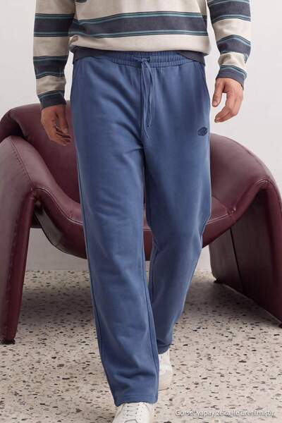 Trendyol Collection Pantaloni de trening tricotați cu broderie cu slogan Indi...