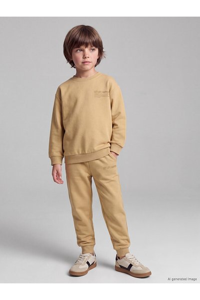 LC Waikiki NEVAVM Farkıyla LCW Kids طقم بدلة رياضية للأولاد باللون الأصفر مكو...