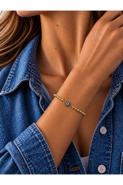 Sacha Accessories سوار ذهبي من دوريكا بتصميم توبوكو مع تميمة العين الشريرة