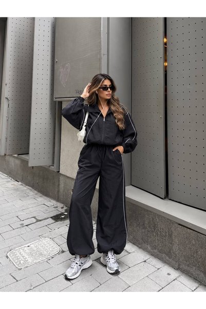 SUYA US WEAR طقم نسائي مكون من سترة قصيرة بسحّاب واسعة الحجم من قماش الباراشوت وبنطلون واسع الساقين