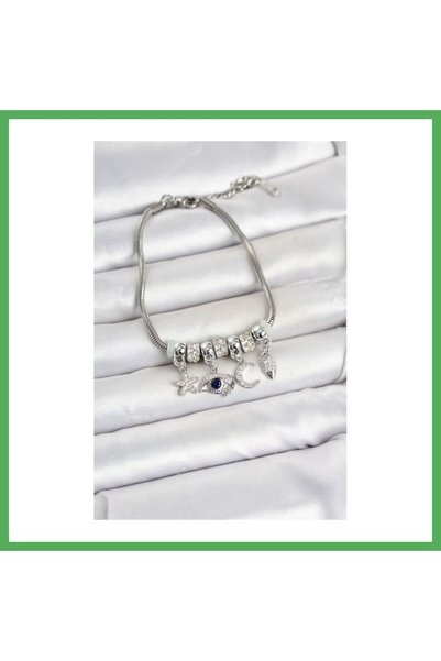 Nur store Çanta سوار نسائي من النحاس باللون الفضي مع تفاصيل على شكل عين من BE...
