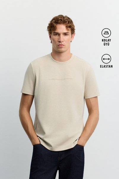 Avva Men's Beige Crew Neck Shiny Rubber Printed Interlock Regular Fit T-Shirt...