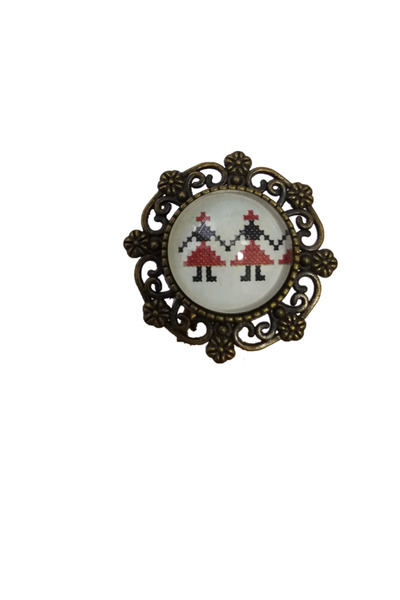 Marc Round bronze ring with traditional embroidered motif and floral frame