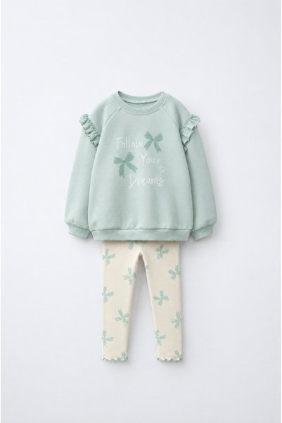 Magu Girls' sweatshirt and leggings set with bow print and patterned design.