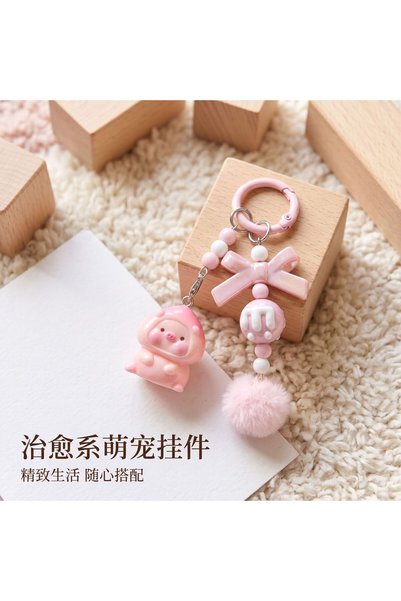 Generic Cute pink pig keychain with a tilted head, ballet-style peach pig hai...