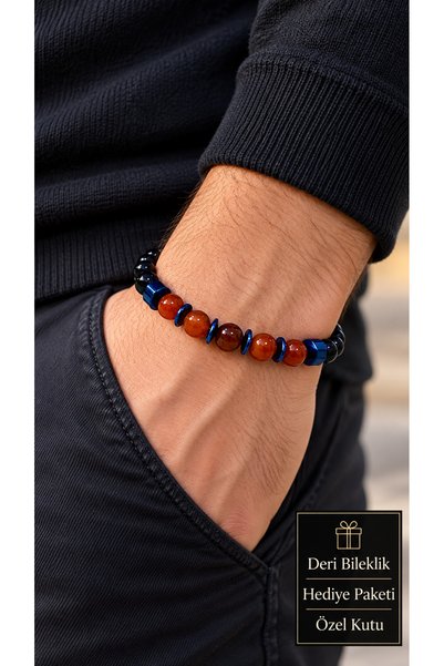 HER ŞEY NOTA www.herseynota.com Varnelis Orelva Black, Orange, and Blue Beade...