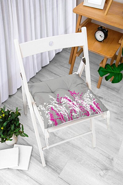 Realhomes Fuksija i beli cvet dizajnirani jastuk za pufnu stolicu na sivom podu