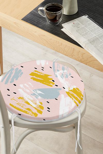 Realhomes Round Zippered Chair Cushion with Water Colored Gold and Blue Drawings on Pink Background