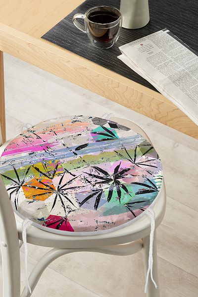 Realhomes Round Zippered Chair Cushion with Geometric Leaf Pattern on Colorful Floor