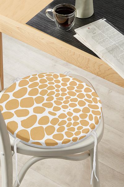 Realhomes Pastel Colored Geometric Patterned Modern Round Zippered Chair Cushion on White Background