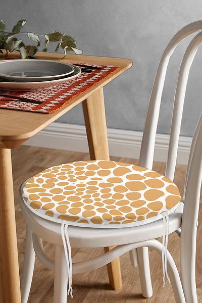 Realhomes Pastel Colored Geometric Patterned Modern Round Zippered Chair Cushion on White Background
