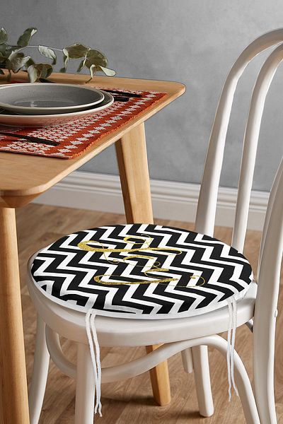 Realhomes Black Zigzag Digital Printed Round Zippered Chair Cushion with Gold Detail on White Background