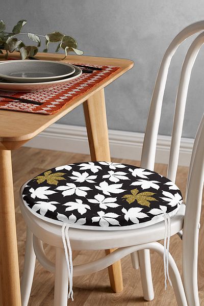 Realhomes Modern Round Zippered Chair Cushion with Gold Detail and White Flower Pattern on Black Background
