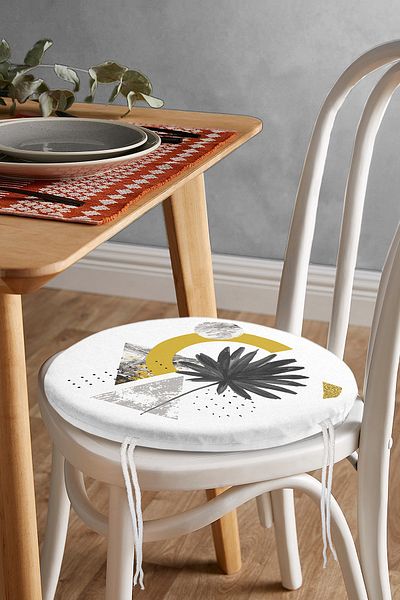 Realhomes Round Zippered Chair Cushion with Flower Motif that Spills Seeds on Geometric Marble Floor