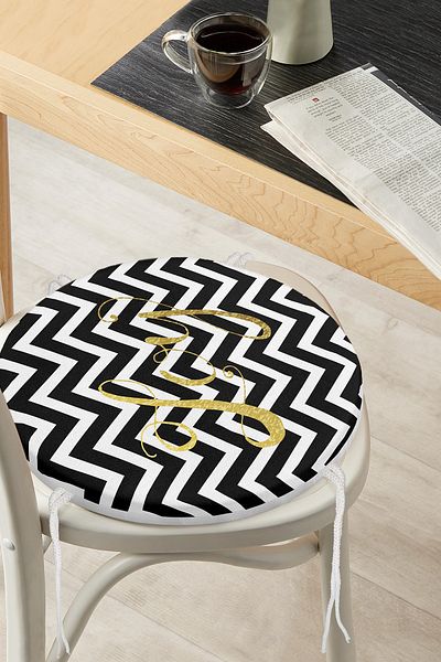 Realhomes Black Zigzag Digital Printed Round Zippered Chair Cushion with Gold Detail on White Background