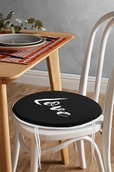 Realhomes Modern Round Zippered Chair Cushion with Love Written on Black Background