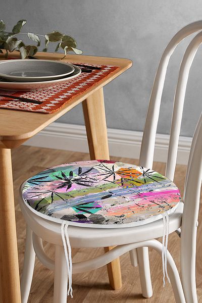 Realhomes Round Zippered Chair Cushion with Geometric Leaf Pattern on Colorful Floor