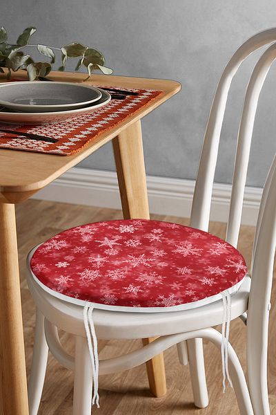 Realhomes Round Zippered Chair Cushion with Snowflakes on Red Background