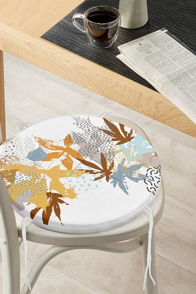 Realhomes Blue and Orange Leaf Patterned Round Zippered Chair Cushion on White Background