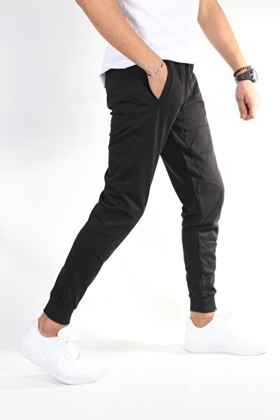 TREND YAŞAR Unisex crne elastične trenirke sa manžetama