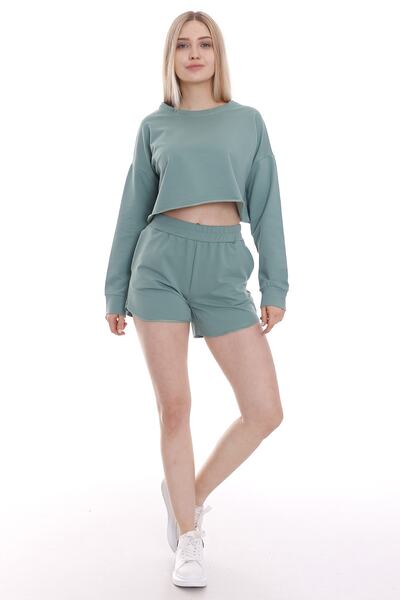 DISENTIS MODEST Жіночі шорти зеленого кольору з кишенями з боків та еластични...