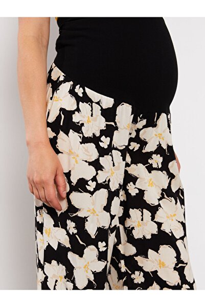 LC Waikiki Květinové těhotenské kalhoty s břišním panelem a elastickým pasem od Aymira Clothing