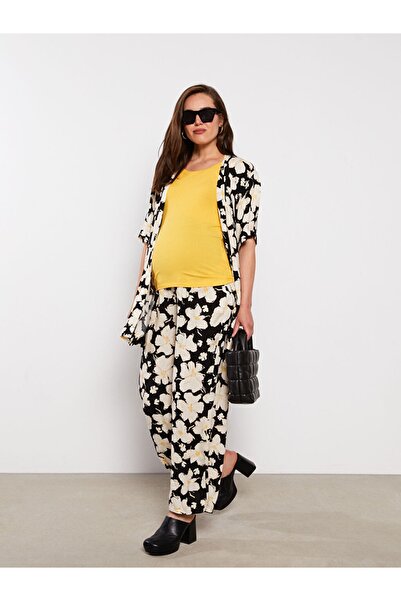 LC Waikiki Květinové těhotenské kalhoty s břišním panelem a elastickým pasem od Aymira Clothing