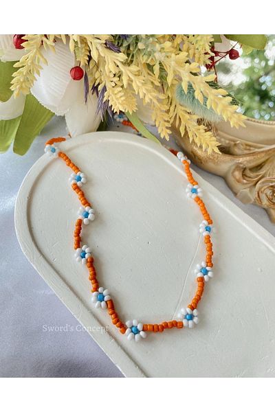 SWORDS CONCEPT Orange Beaded Daisy Necklace
