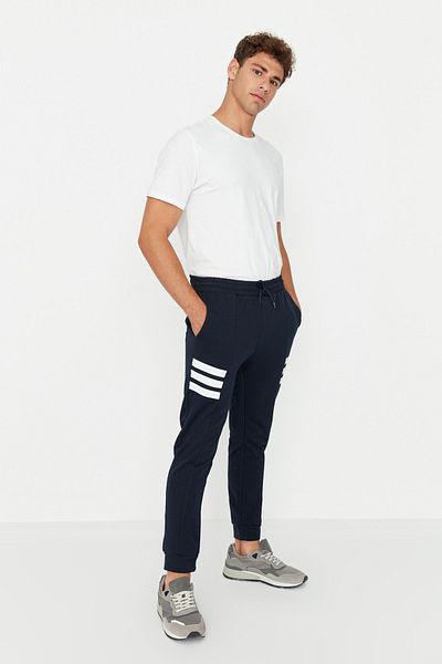 Trendyol Collection Navy Blue Regular Fit Sweatpants - Striped and Elastic Legs TMNAW23EA00146