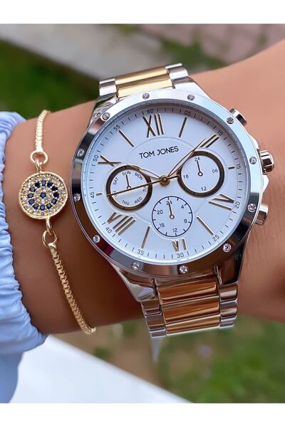Tom Jones ساعة يد نسائية ماركة باللون الأصفر والفضي مع ضمان لمدة عامين -
