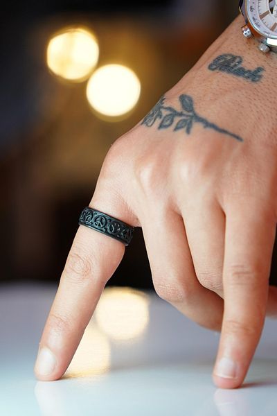 The Collection Adjustable Black Ring with Freedom Chain Figure