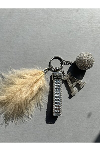 TASARIM ARABAM ATİKE ELİF AKIN قمة ديسكو فضية - سلسلة مفاتيح بأحرف فضية وريش ...