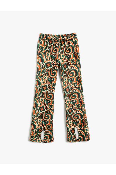 Koton Geblümte Hose mit ausgestelltem Bein und Schlitzdetail